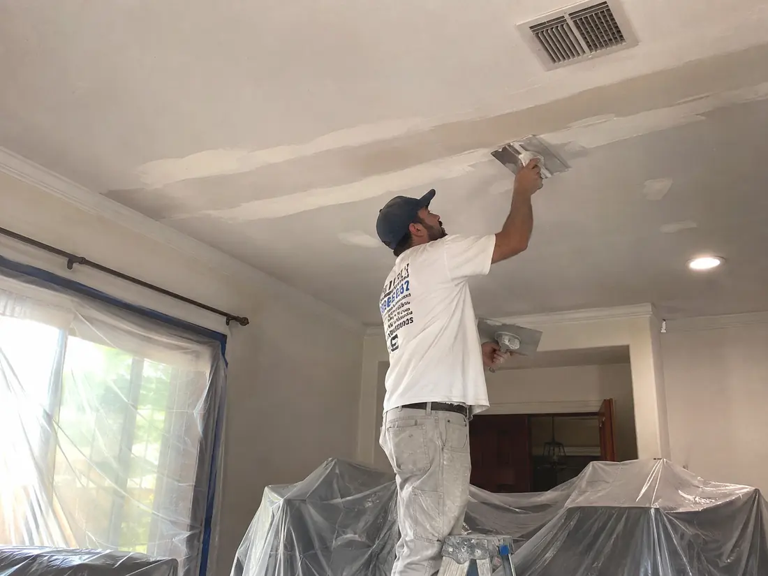Ceiling drywall repair in progress overhead