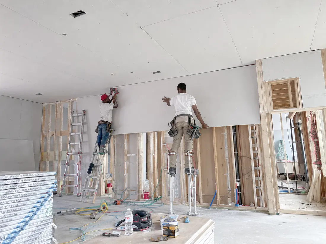 Drywall board being hung on framing in a Shreveport home